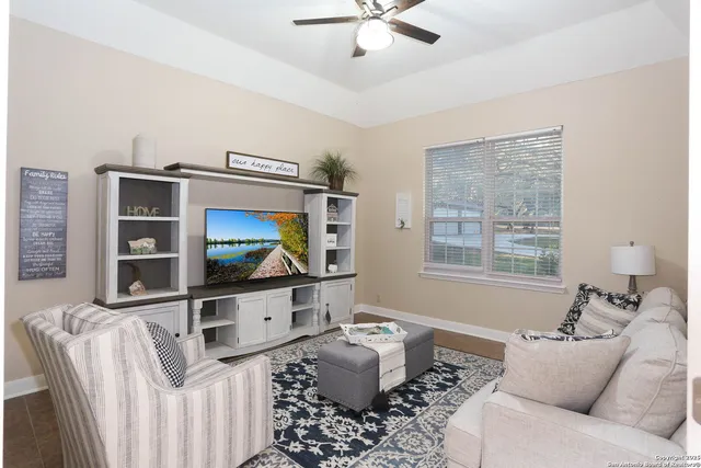 a kitchen with stainless steel appliances kitchen island granite countertop a sink stove and refrigerator