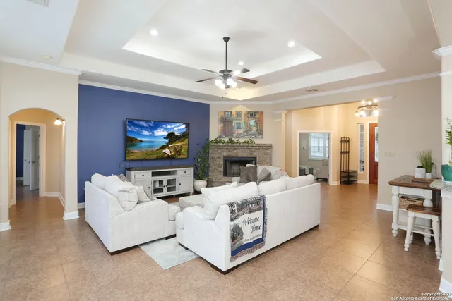 a kitchen with stainless steel appliances granite countertop a sink a stove and a refrigerator