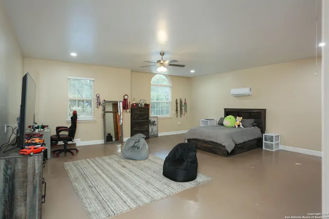 a bedroom with a bed and a dresser