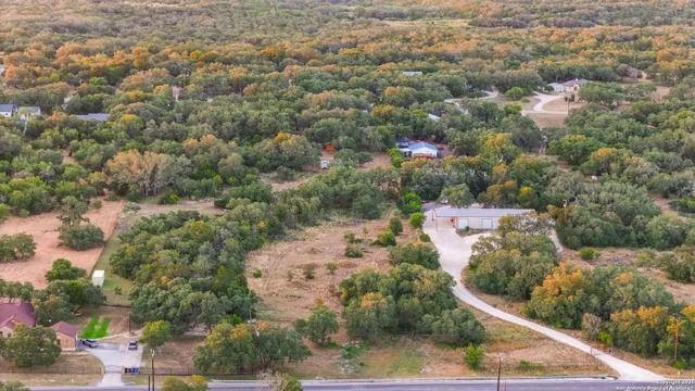 a view of a house with a yard and garden