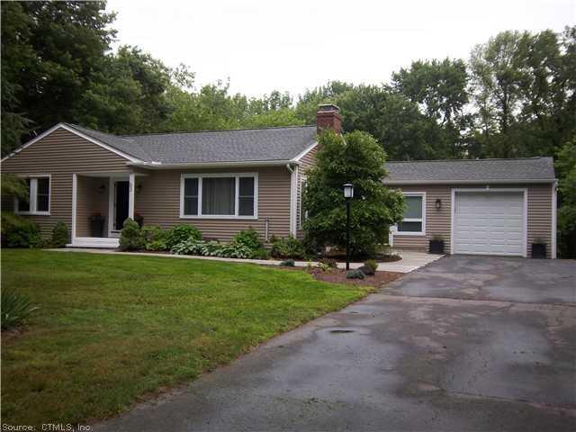 53 Pinecrest Road Orange, CT 06477 - Photo 1 of 1 a front view of a house with a garden
