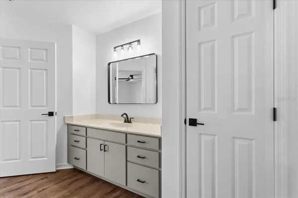 a bathroom with a glass shower door