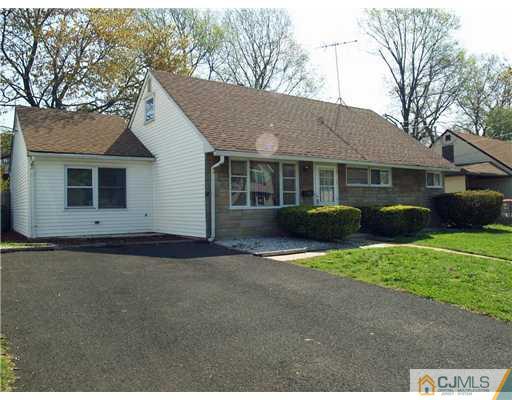28 Stiles Road Edison, NJ 08817 - Photo 1 of 25 a front view of a house with a garden and plants