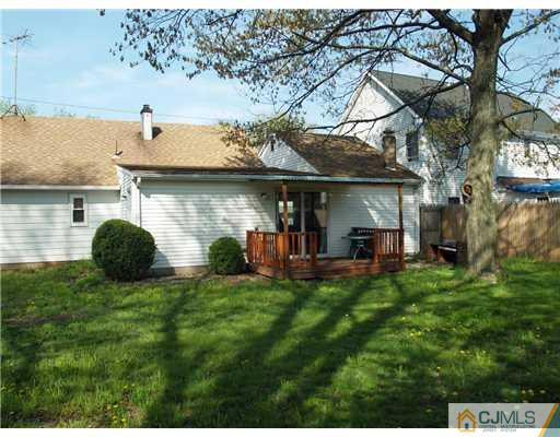 28 Stiles Road Edison, NJ 08817 - Photo 11 of 25 a view of a house with a backyard and sitting area
