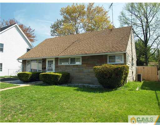 28 Stiles Road Edison, NJ 08817 - Photo 15 of 25 a view of a house with a yard and a garden