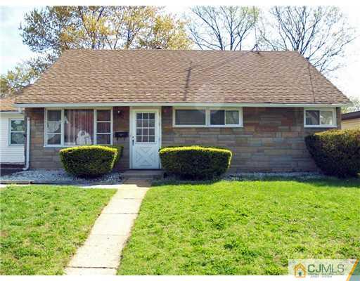 28 Stiles Road Edison, NJ 08817 - Photo 16 of 25 a view of house with backyard and seating space