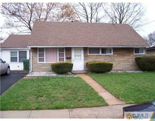 28 Stiles Road Edison, NJ 08817 - Photo 22 of 25 a front view of house with yard and outdoor seating