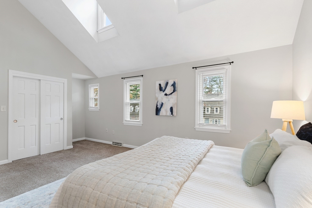 730 Wellman Avenue, Unit 730 Chelmsford, MA 01863 - Photo 16 of 31 a bedroom with a bed and a window