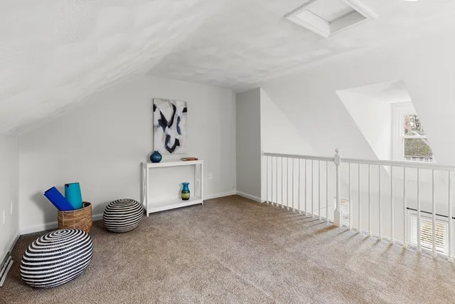 a view of a hallway with windows