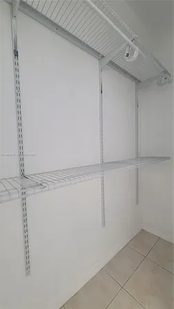 a view of a room with wooden walls