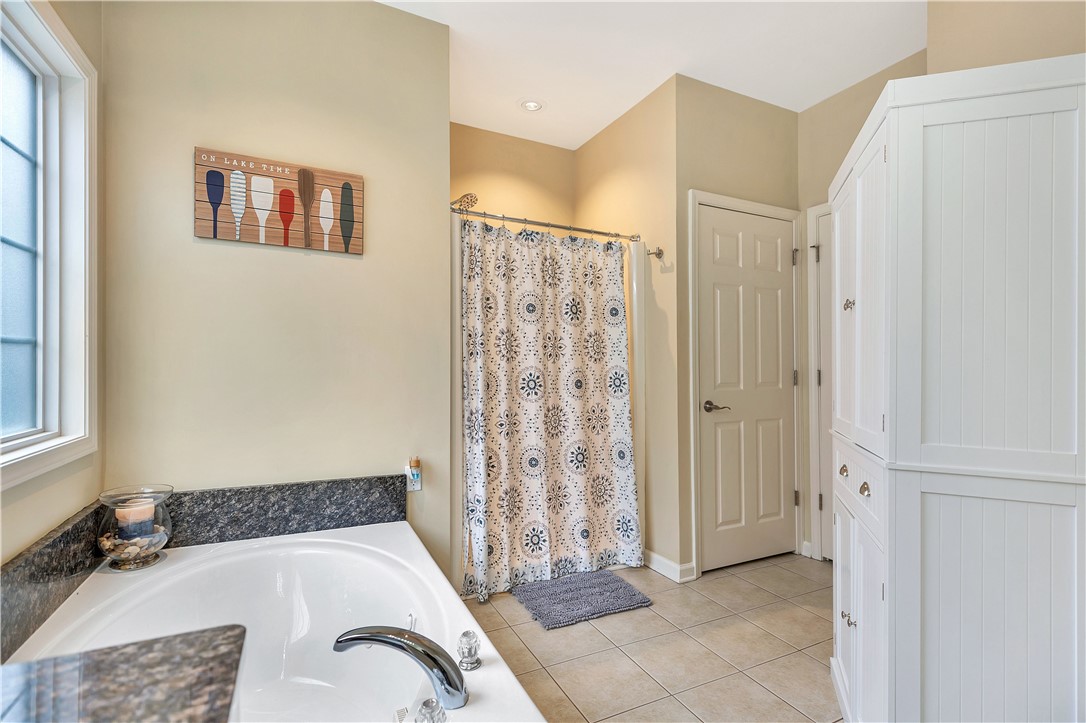 101 Riviera Circle Anderson, SC 29621 - Photo 20 of 35 This bathroom features a soaking tub, recessed lighting, and tile flooring, offering a comfortable retreat.