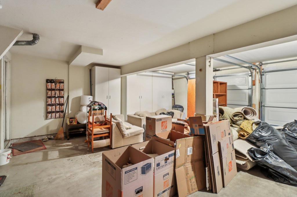 7747 Caminito Monarca, Unit 100 Carlsbad, CA 92009 - Photo 59 of 67 a room with gym equipment and large windows