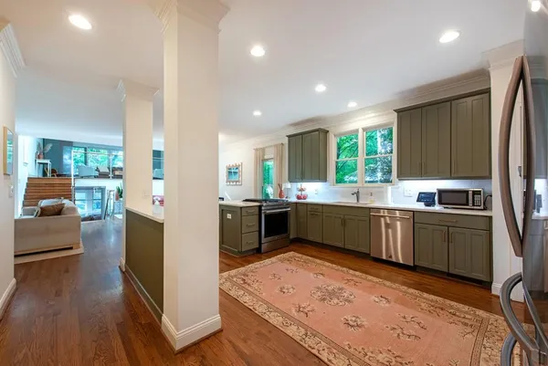a view of a dining room with furniture and wooden floor