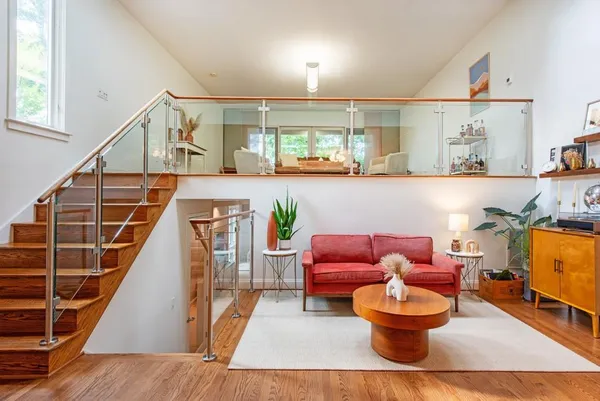 a living room with furniture and a large window
