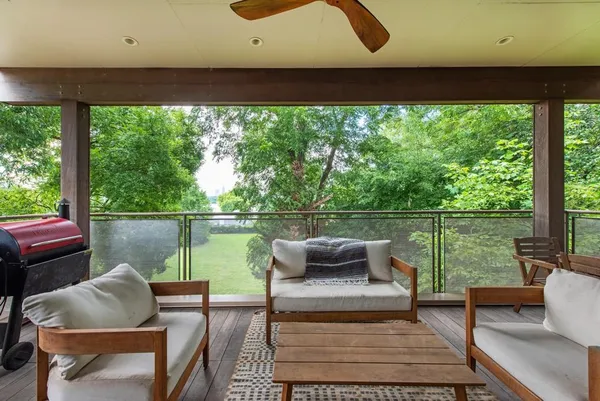 a view of a livingroom with furniture and hardwood floor