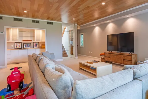 a bedroom with a bed and flat screen tv