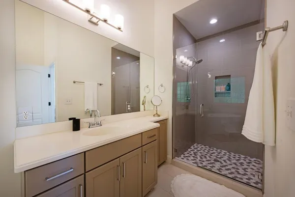 a bathroom with a sink a toilet and shower curtain