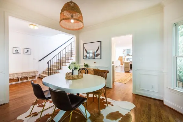 a kitchen with a sink a counter top space stainless steel appliances and cabinets