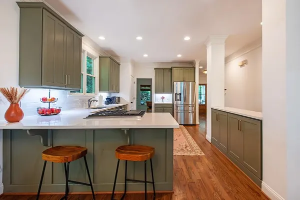 a kitchen with a sink cabinets and window