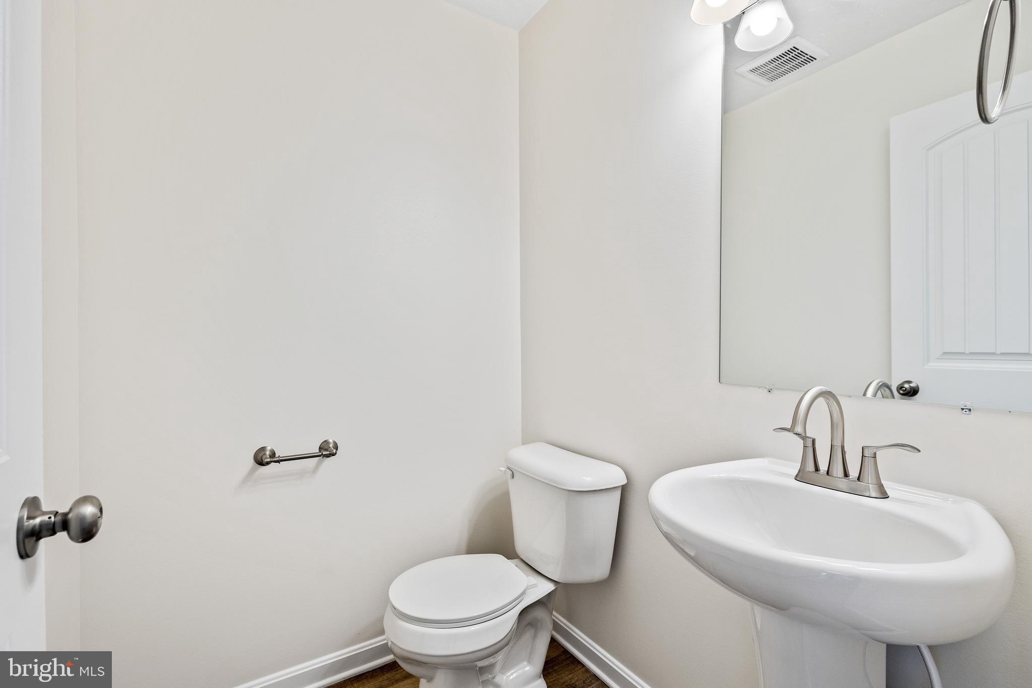 1201 Walnut Bottom Road, Unit 1102 Carlisle, PA 17015 - Photo 13 of 36 a bathroom with a sink a toilet and mirror