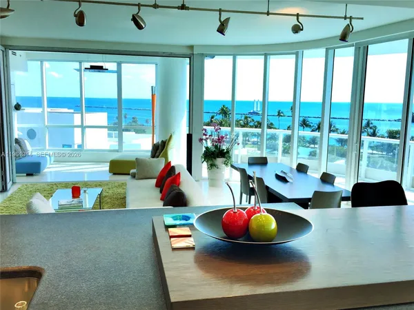 a room with furniture and a large window