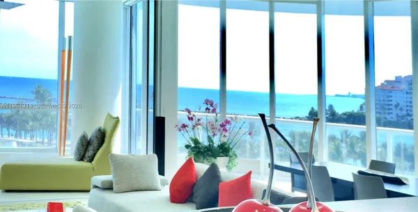 a view of a room with a floor to ceiling window