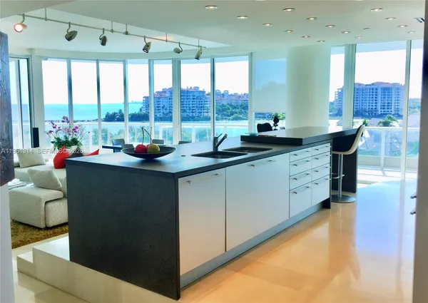 a kitchen with a sink and large window