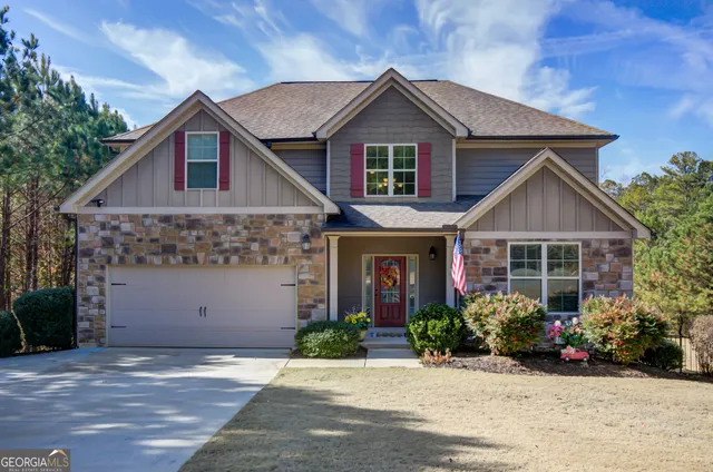 a view of house with tub and outdoor seating