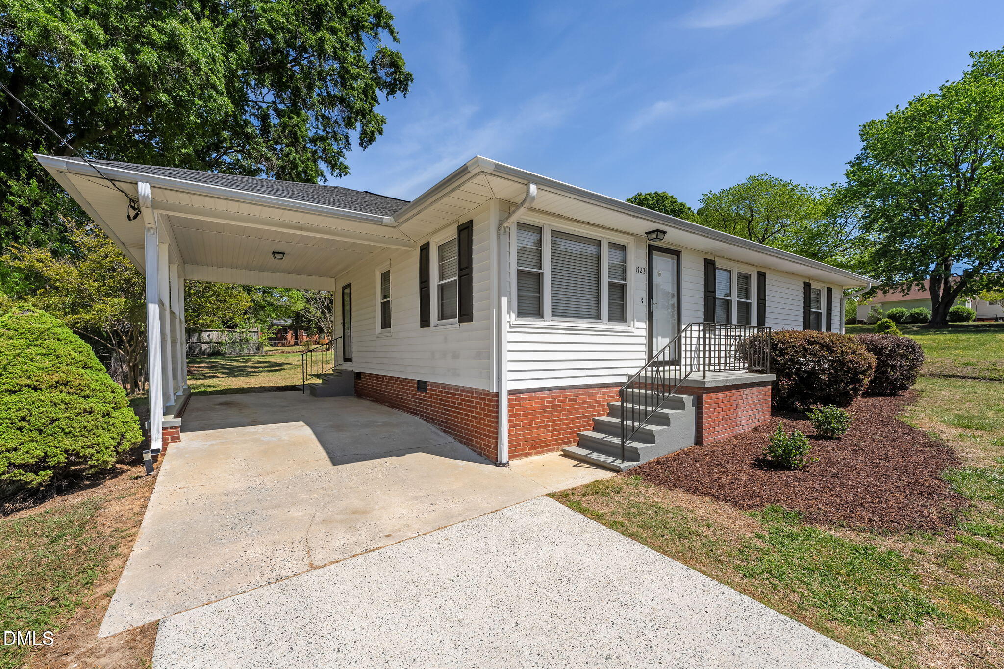 1723 Power Line Road Elon, NC 27244 - Photo 18 of 22 a front view of a house with garden