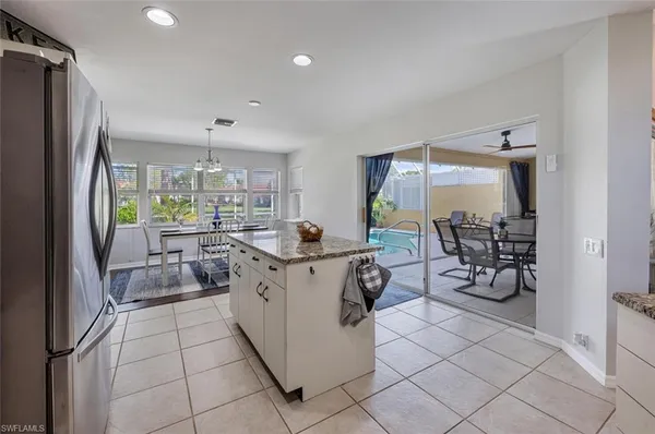 a bedroom with a bed and a dresser with mirror