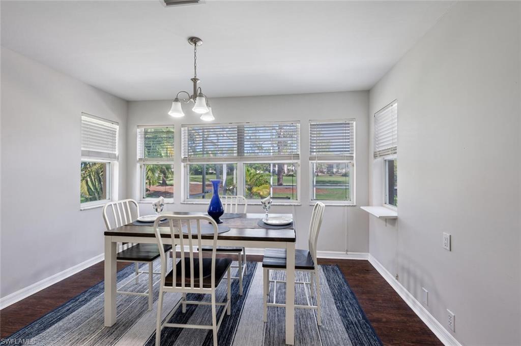 641 St Andrews Boulevard, Unit 1081 Naples, FL 34113 - Photo 16 of 31 a view of a dining room with furniture window and outside view