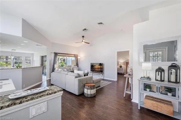 a living room with furniture and a rug