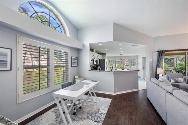 a workspace with furniture and window