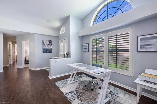 a workspace with furniture hardwood and a window