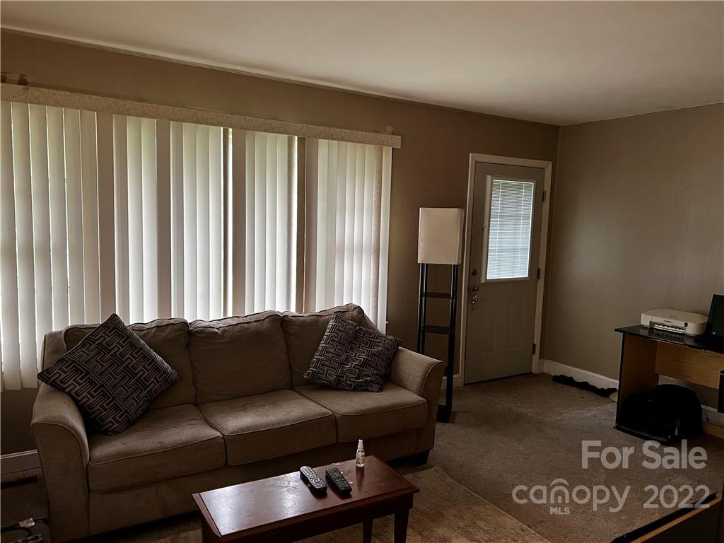 196 London Road Asheville, NC 28803 - Photo 3 of 14 a living room with furniture and a couch