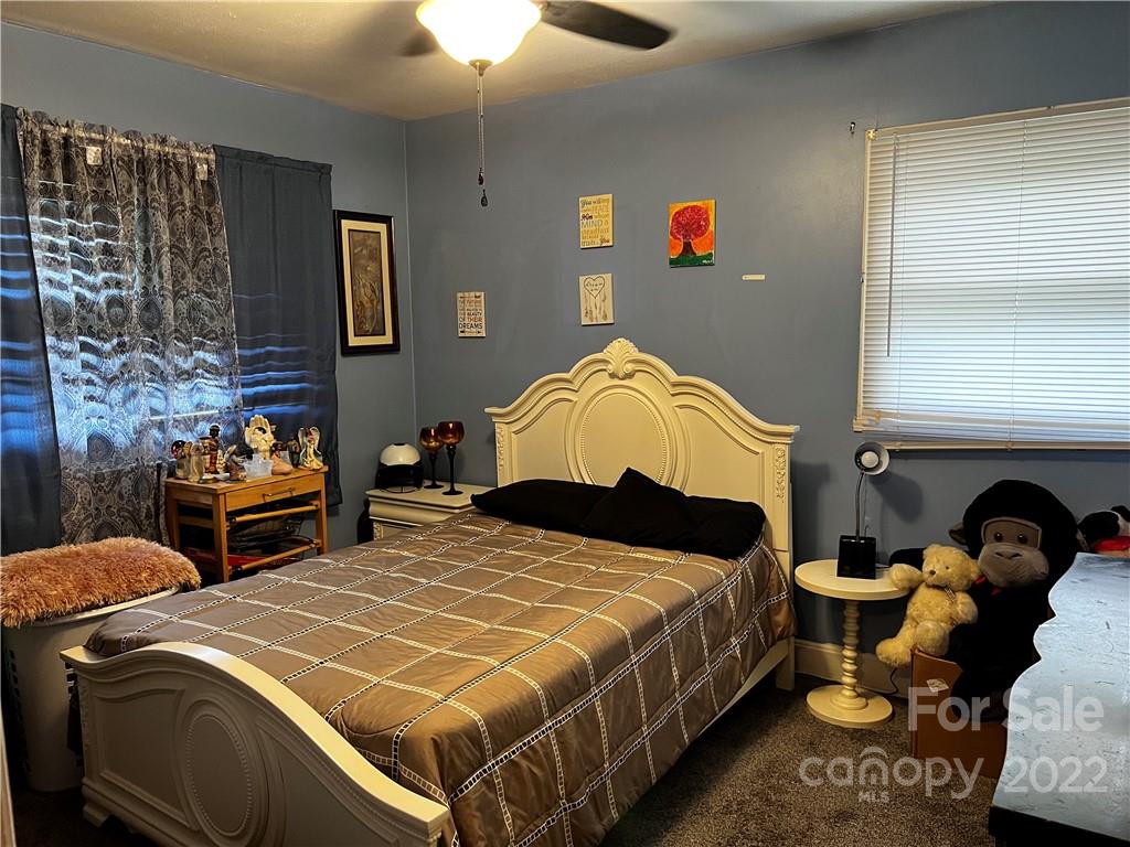 196 London Road Asheville, NC 28803 - Photo 10 of 14 a bedroom with double bed and a closet