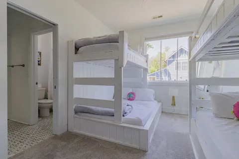 a bedroom with a bed and a chair