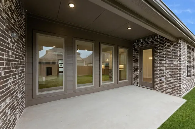 a view of a glass door of the house