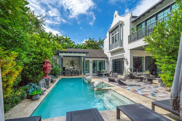a front view of house with yard and outdoor seating