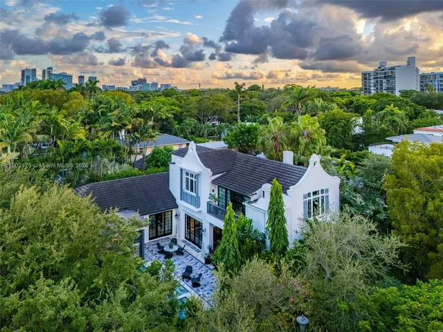 a view of a house with a yard and a garden