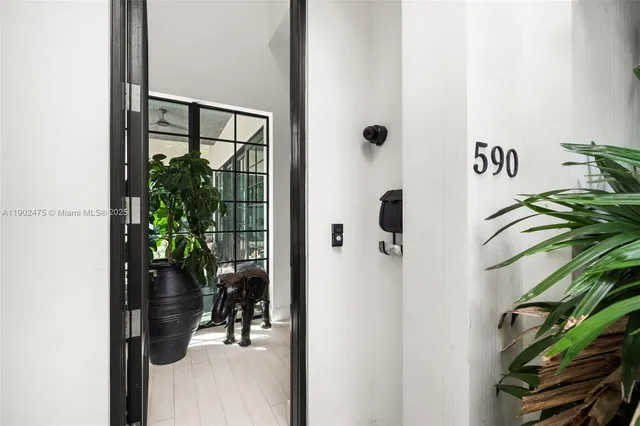 a living room with furniture and flowers