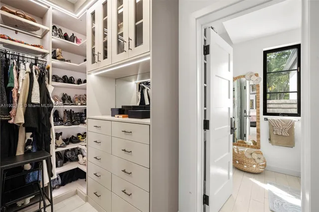 a front view of a house with swimming pool outdoor seating