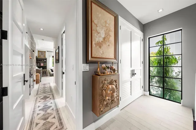 a front view of a house with swimming pool and sitting area