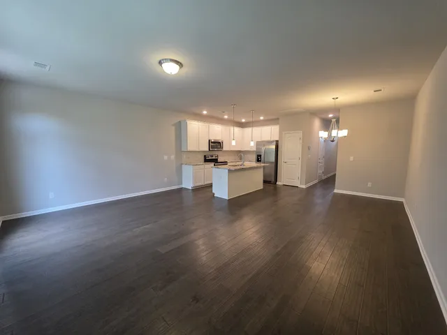a view of kitchen with wooden floor
