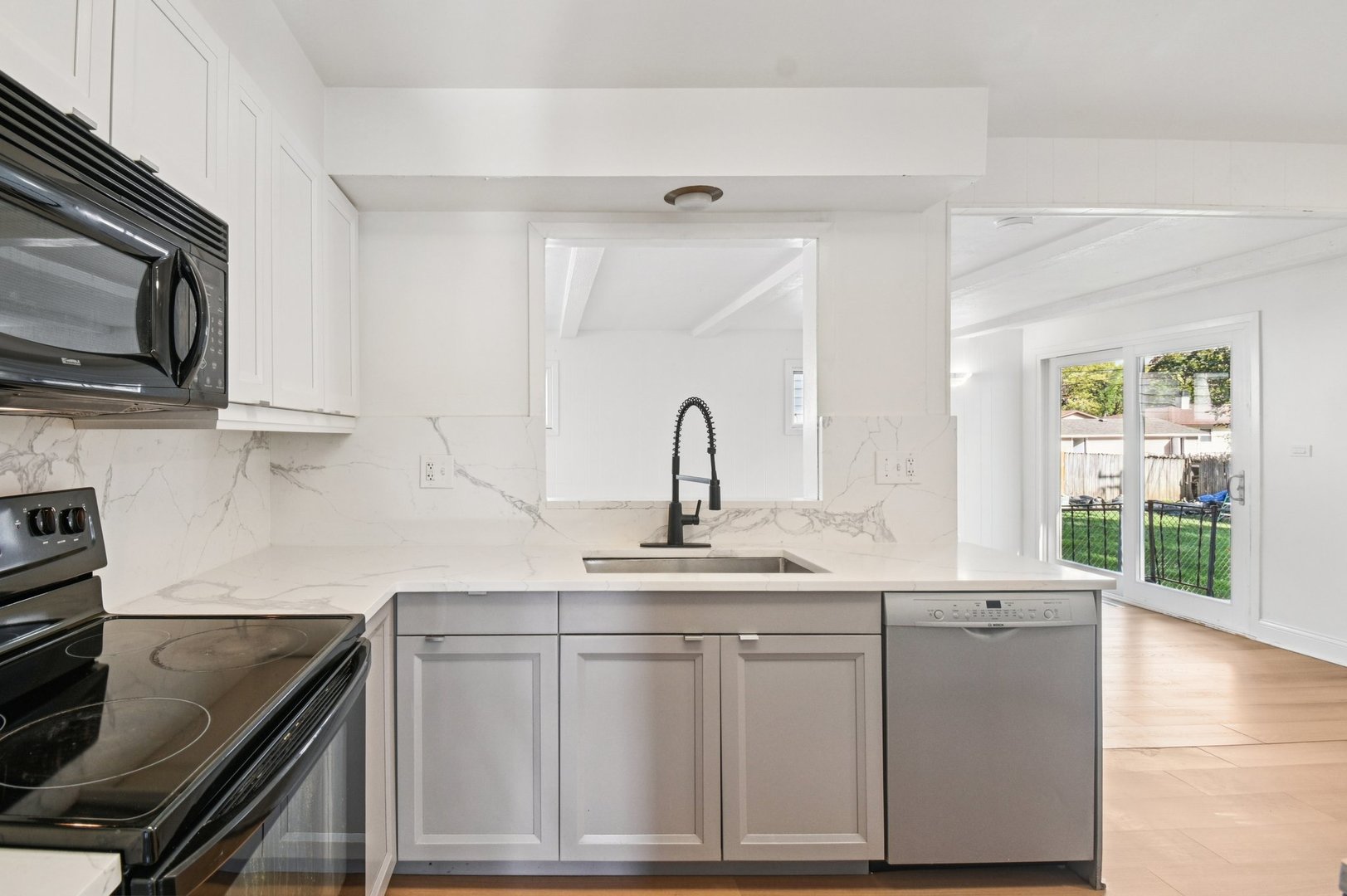 207 North Idlewild Avenue Mundelein, IL 60060 - Photo 13 of 46 a kitchen with stainless steel appliances granite countertop a sink stove and microwave
