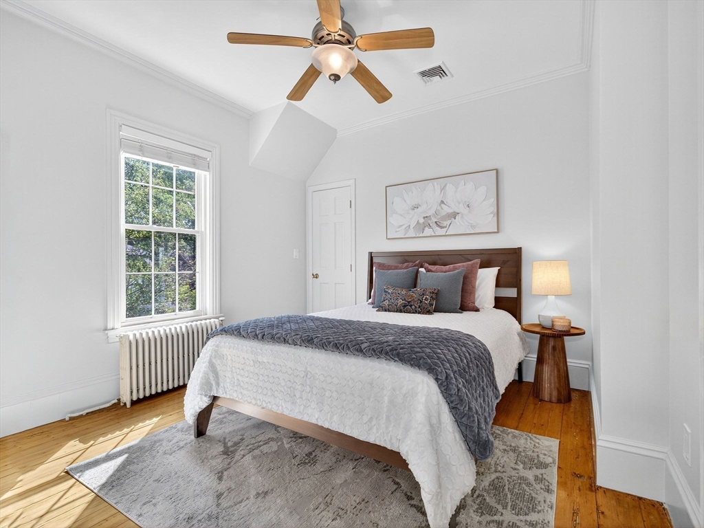 24 Evergreen Street, Unit 2 Boston, MA 02130 - Photo 12 of 31 a bedroom with a bed and a window