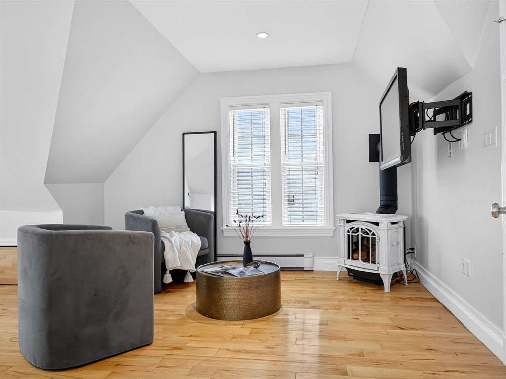 24 Evergreen Street, Unit 2 Boston, MA 02130 - Photo 20 of 31 a living room with furniture and a potted plant