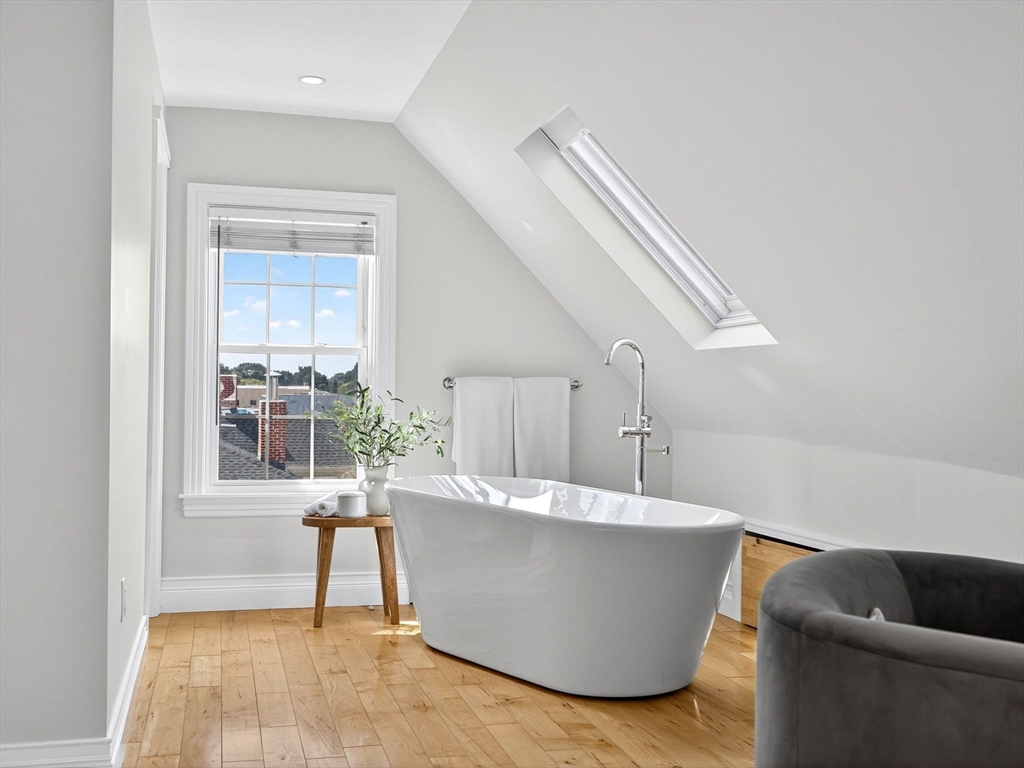 24 Evergreen Street, Unit 2 Boston, MA 02130 - Photo 21 of 31 a living room with a couch and a potted plant