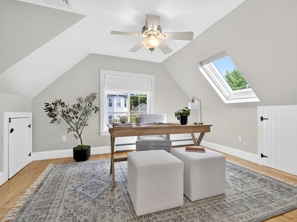 24 Evergreen Street, Unit 2 Boston, MA 02130 - Photo 24 of 31 a living room with a couch and a chandelier