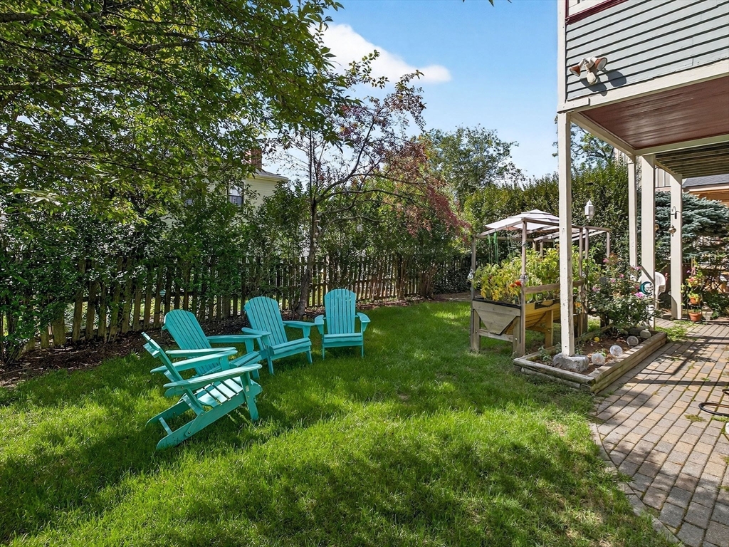 24 Evergreen Street, Unit 2 Boston, MA 02130 - Photo 26 of 31 a view of a chair and table in backyard of the house